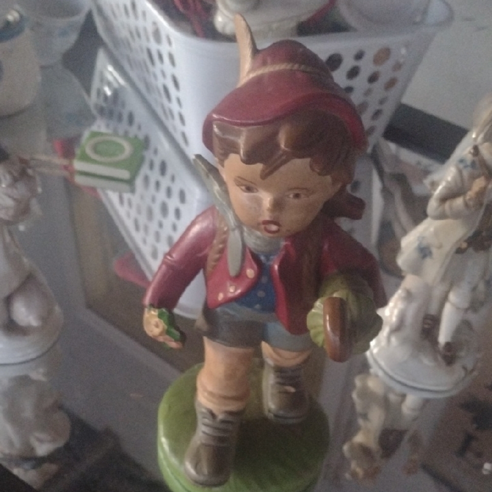 Charming Figurine with Red and Green Accents